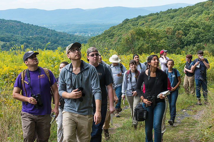 Smithsonian Mason Smithsonian Mason students walk through the mountains on the grounds of the Smithsonian Biology Conservation Institute
