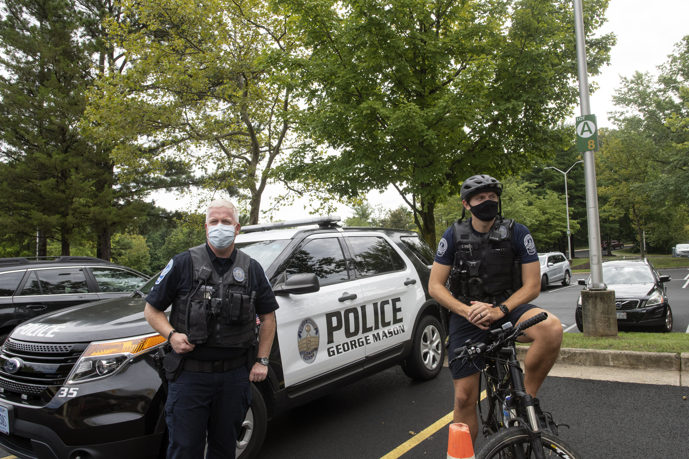 Mason police officers Mason police officers, one in front of patrol car, on one bicycle